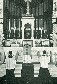 Priest Kisses the Altar