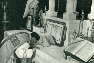 Priest Kisses the Altar